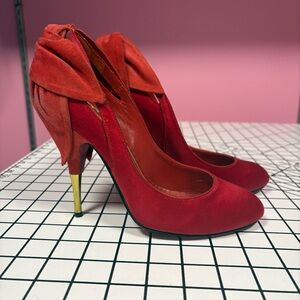 Red satin and suede Betsy Johnson heels.